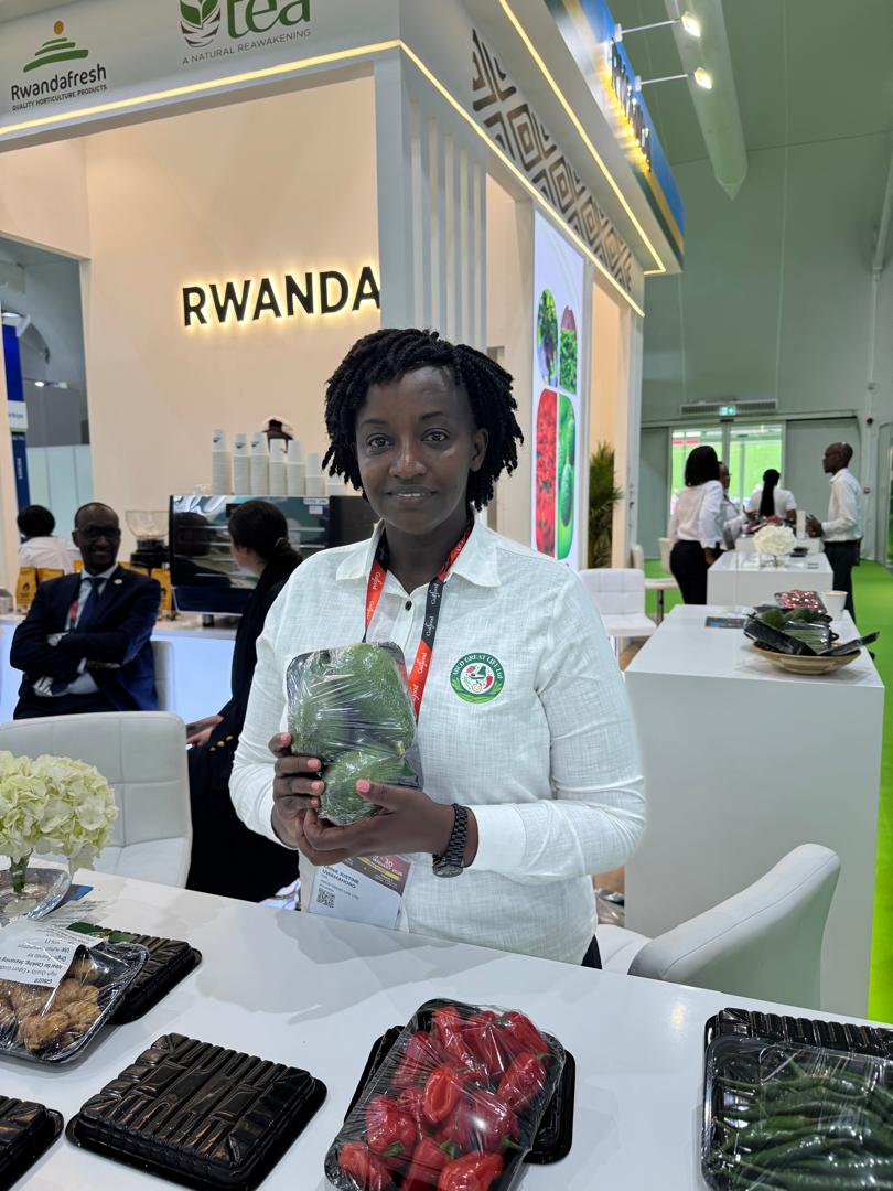 ABCD GREAT LIFE founder presenting fresh Rwandan produce at an international trade fair